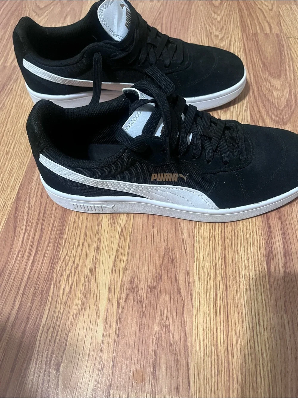 Puma Black Suede Sneakers with White Tongue and Gold Logo